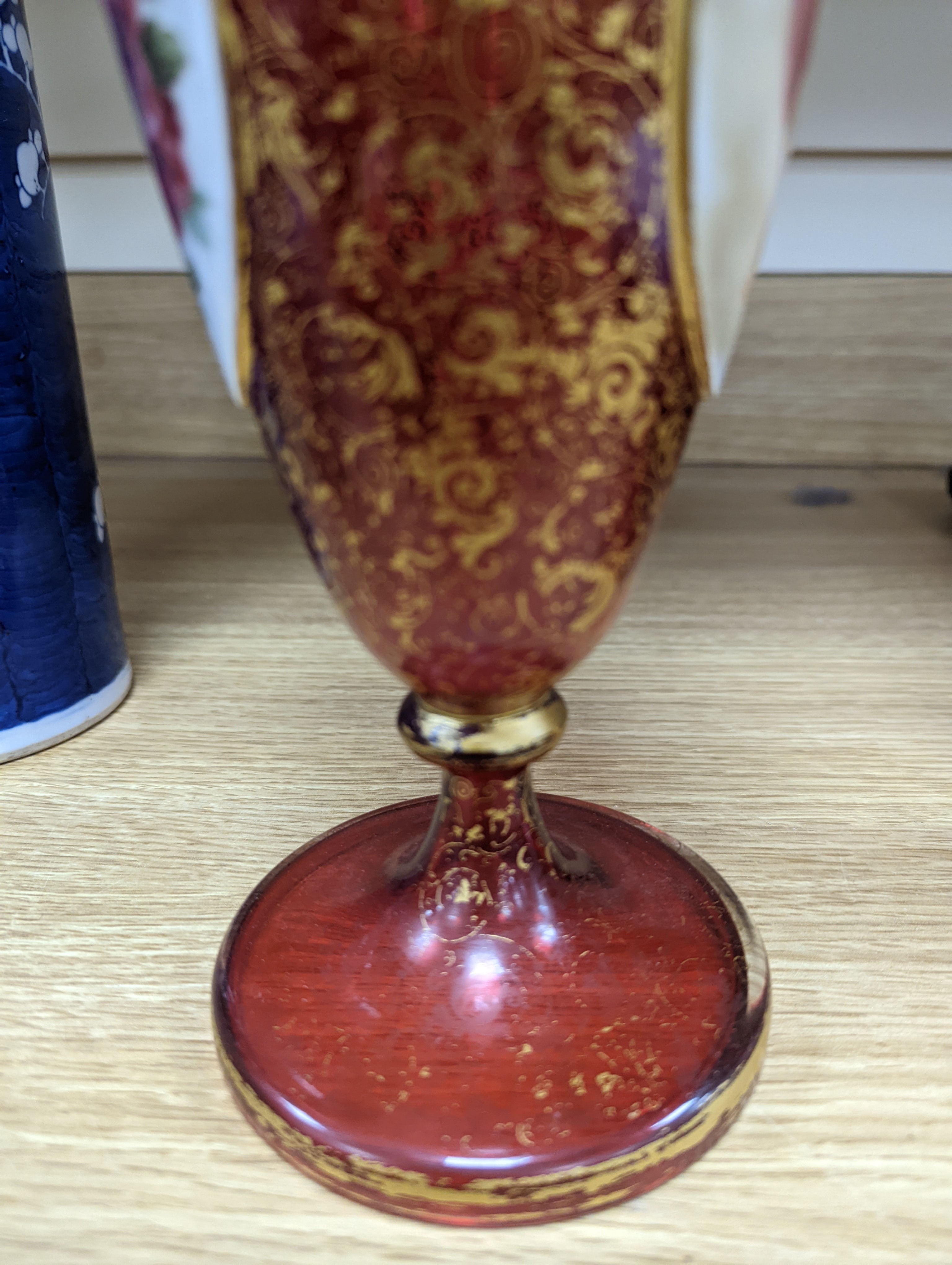 A pair of 19th century Bohemian enamelled and overlaid ruby glass vases 36cm